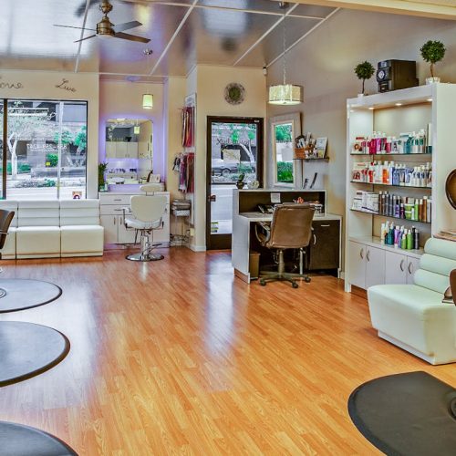 Spacious hair salon in Del Mar, California featuring contemporary design and ample seating.