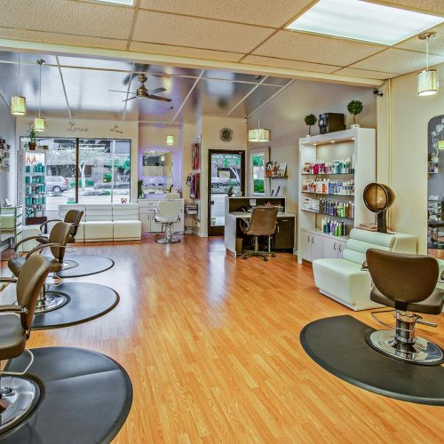 Spacious hair salon in Del Mar, California featuring contemporary design and ample seating.